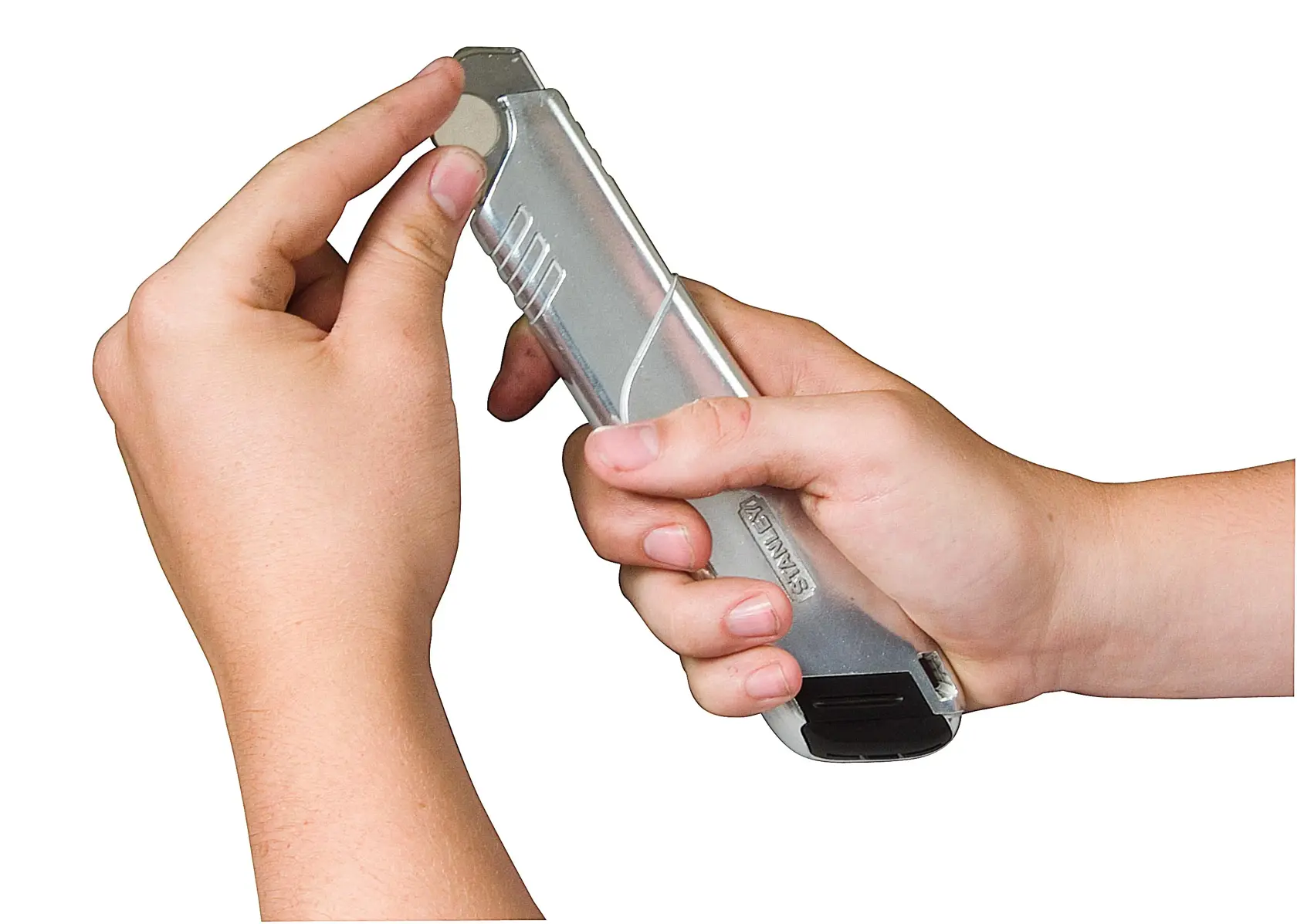 Photo of STANLEY 0-10-820 utility knife held in hands, showing the blade being extended.