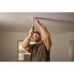 STANLEY 0-68-012 screwdriver photo showing person using tool indoors in residential setting.