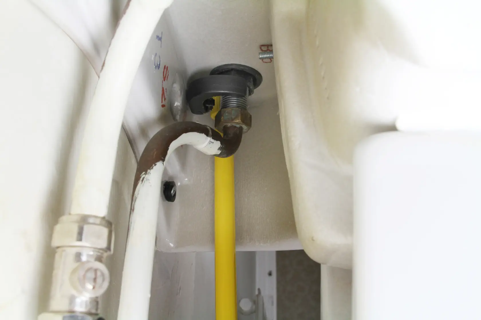 STANLEY 0-70-453 plumbing installation photo showing pipe connections under a sink, close-up angle.