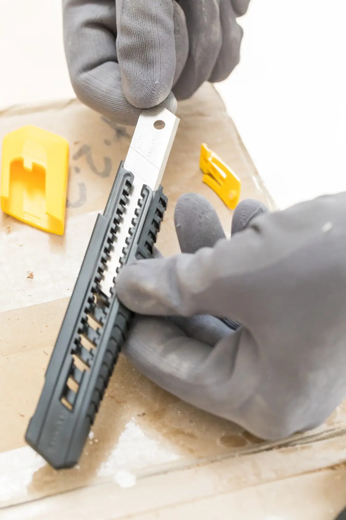 Stanley utility knife with a retractable blade, black and yellow handle, shown on a white background.