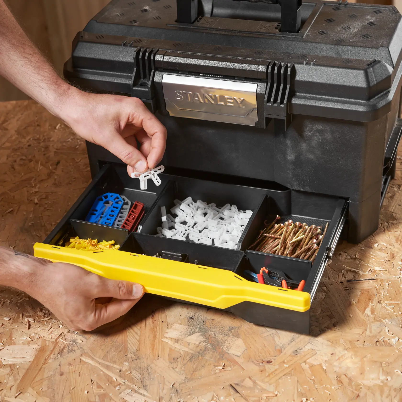 STANLEY 1-70-316 toolbox with organized compartments and accessories, front angle, photo of hands opening tray