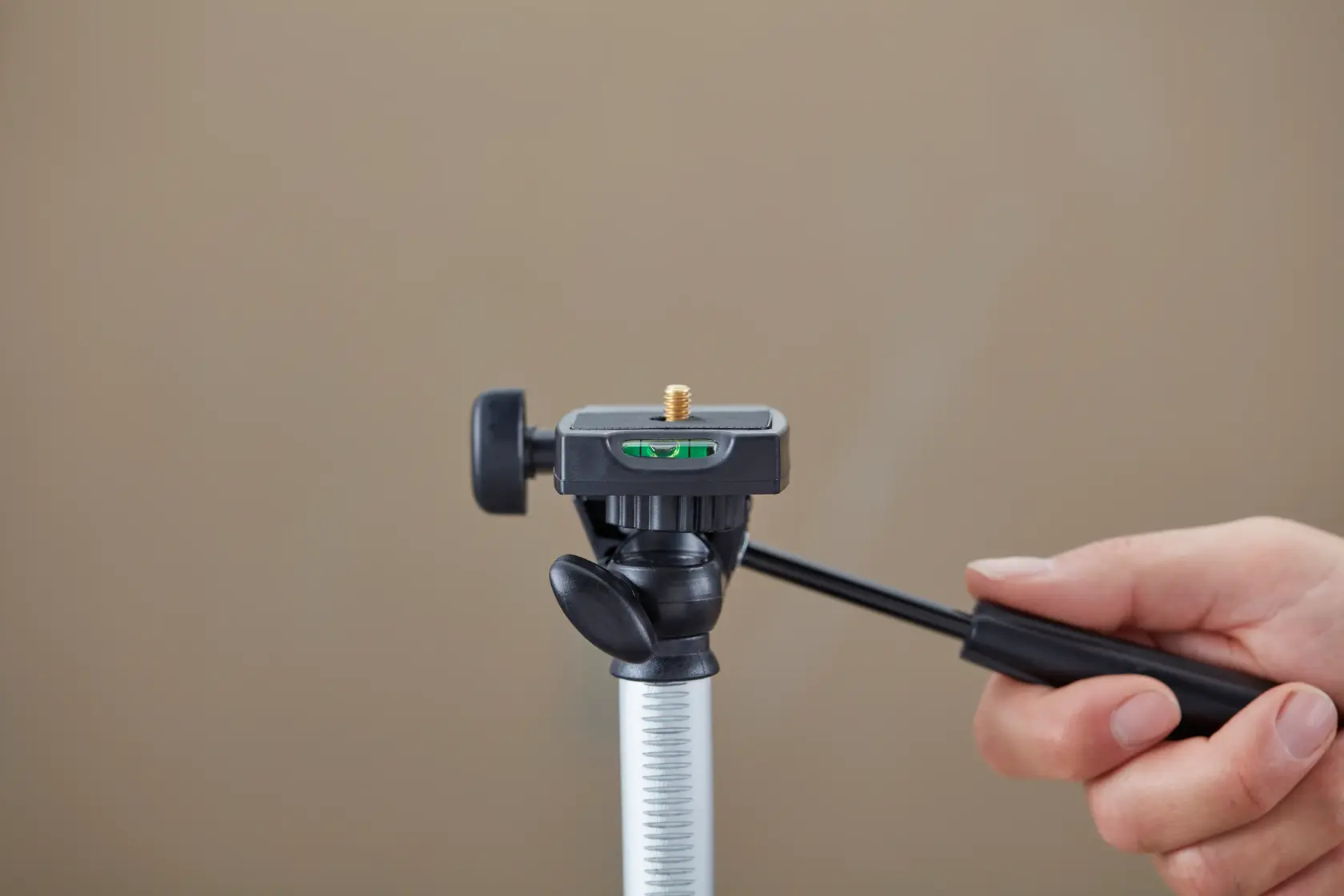 STANLEY 1-77-201 photography tripod, silver with black accents, front angle on white background.