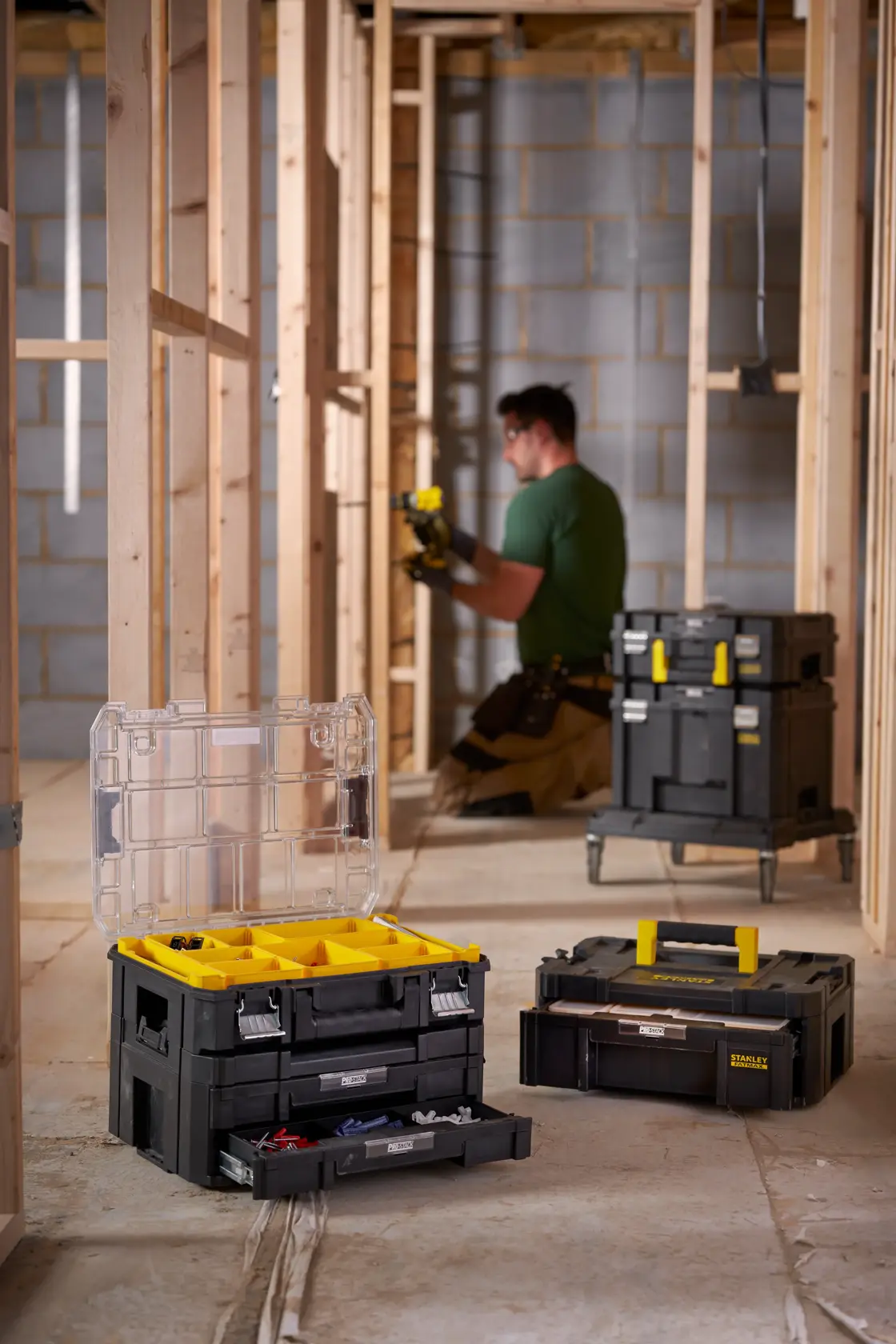 STANLEY FMST1-71968 stackable toolboxes and organizers in a construction site, open and closed views.