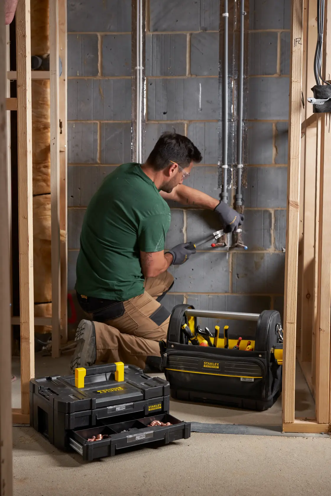 Stanley FMST1-71969 tool bag and organizer on site with tools, photo of product in use near wall construction.