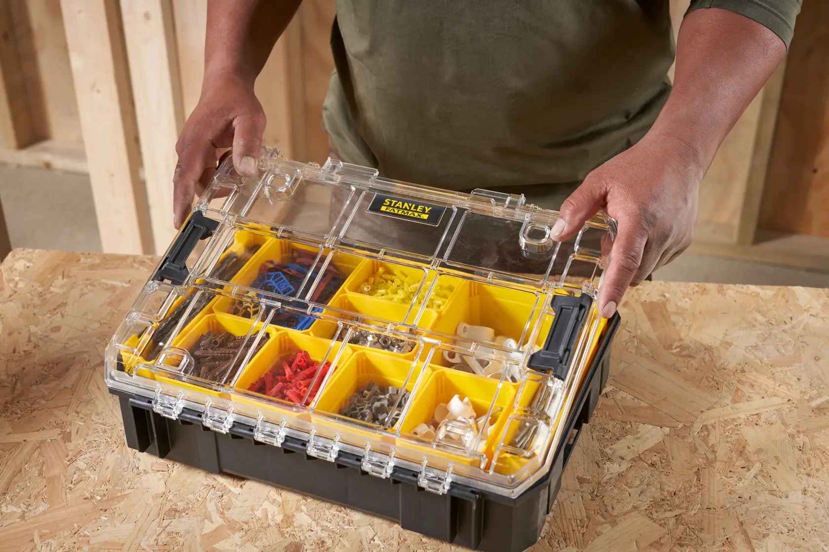 STANLEY FMST82967-1 organizer box with yellow compartments and clear lid, filled with assorted hardware.