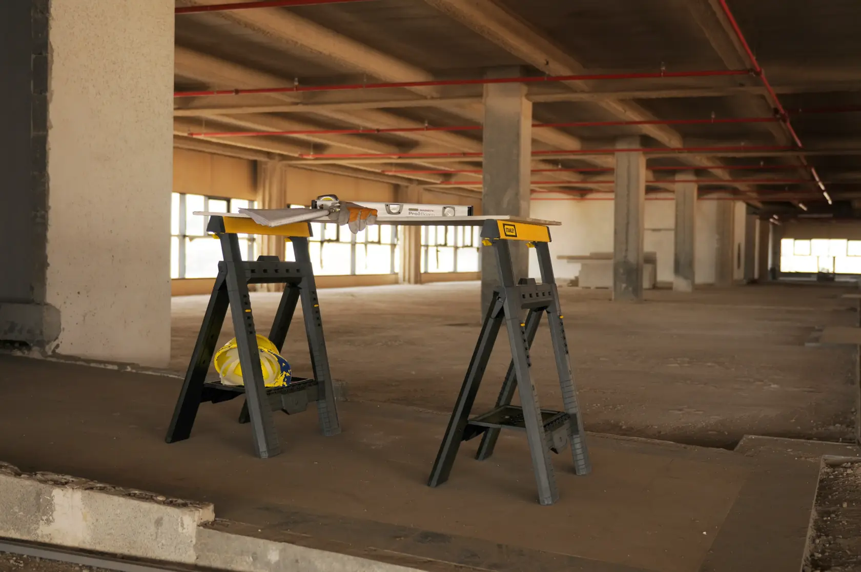 Photo of STANLEY STST1-70559 black and yellow plastic folding sawhorses, front angle, product pair.