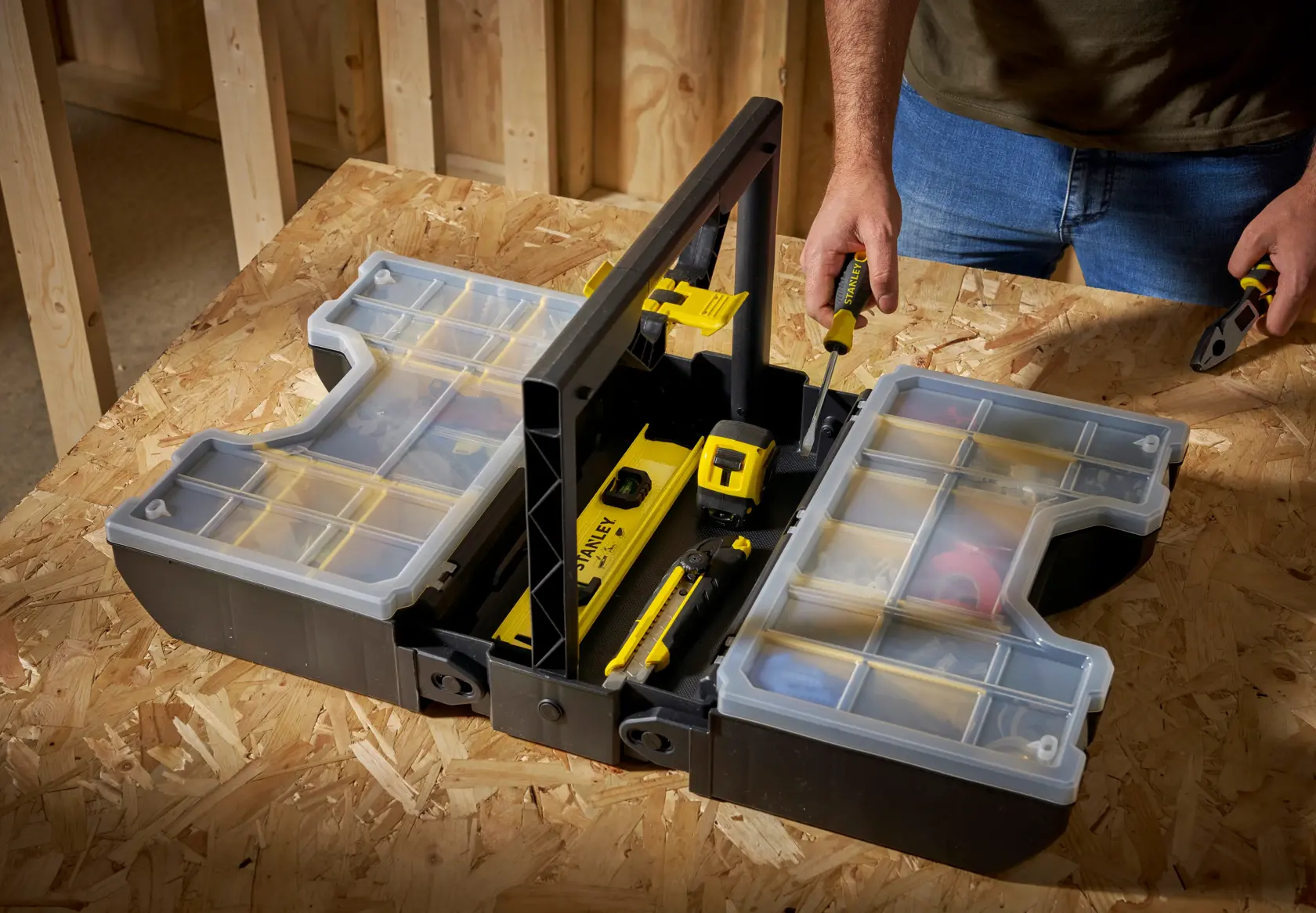 STANLEY STST1-71963 portable organizer with clear lid compartments on workbench, tools inside, top view